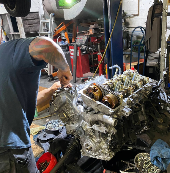 Mechanic working on engine